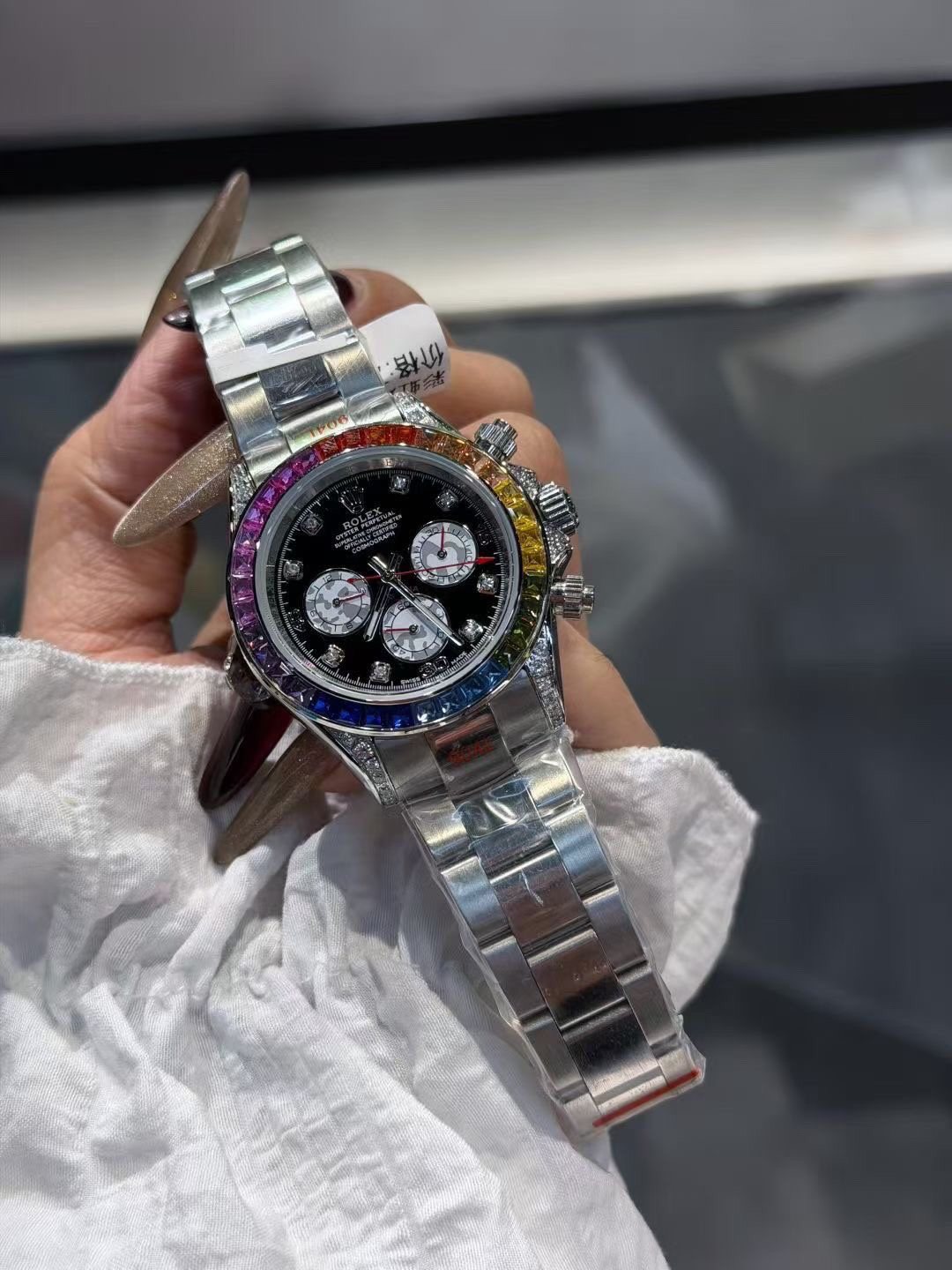 Rolex Rainbow Bezel Black Dial Watch — front